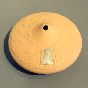 Sterling silver Shifting Sands inlay on a tan seed pot with a lightly carved Shifting Sands design