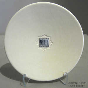 Sterling silver Shifting Sands inlay on a white plate