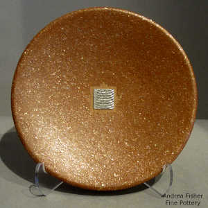 Sterling silver inlay in a tan micaceous plate