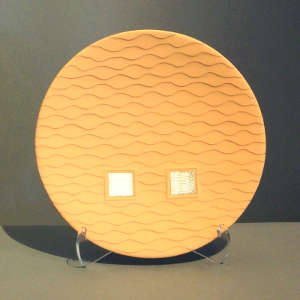 Inlaid sterling silver on a tan micaceous plate