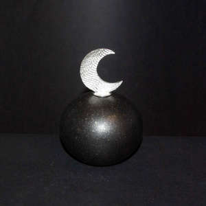 Crescent moon Shifting Sands sterling silver lid on a micaceous black seed pot