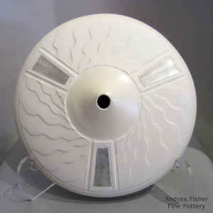 White seed pot with a Sterling silver Shifting Sands design inlay on a Shifting Sands surface