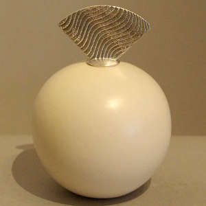 Sterling silver lid on a white seedpot