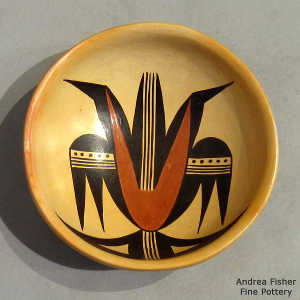 Bird element and geometric design on a polychrome bowl with fire clouds