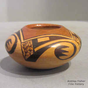 Bat wing and geometric design on a miniature polychrome jar