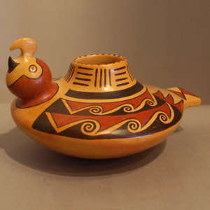 Bird element and geometric design on a polychrome parrot effigy jar