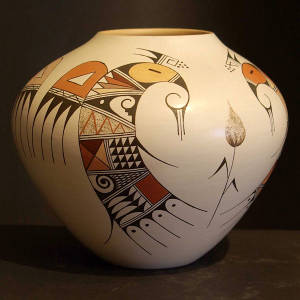 Bird element, flower and shard design on a polychrome whiteware jar