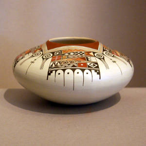 Red and black bird element and shard design on a whiteware jar