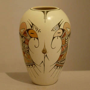 Black and red bird element, shard and flower design on a whiteware vase