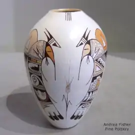 Bird element, flower and geometric design on a polychrome white ware jar