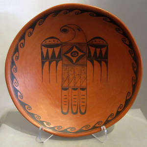 Click for a larger version Red and black thunderbird and water designs on a redware bowl
