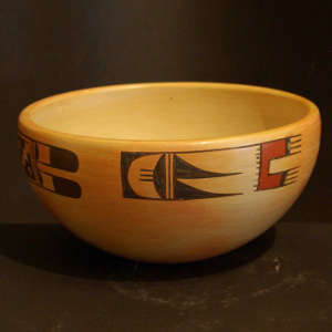 Bird element designs on a yellow ware bowl