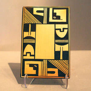 Geometric design on a black on yellow tile