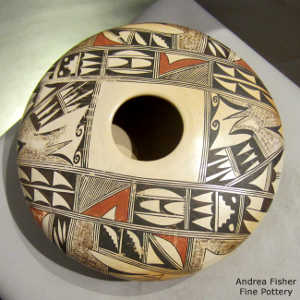 Shard and geometric design on a polychrome yellow ware jar with fire clouds