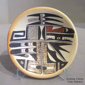 Bird element, fire clouds and geometric design on a polychrome plate
