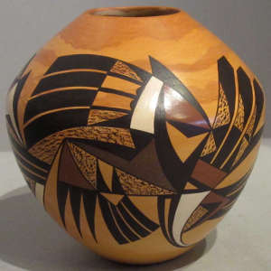 Bird element designs on a polychrome marbleized clay jar