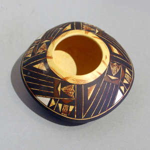 Geometric design on a polychrome yellow ware jar