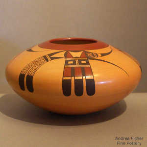 Bird element, geometric design and fire clouds on a polychrome yellow ware jar