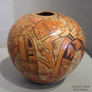 Kokopelli, bird element and geometric design on a polychrome jar