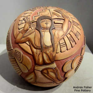 Giving and Receiving the Paho: Carved and painted on a polychrome seed pot