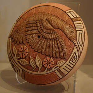 Carved relief on a polychrome pot