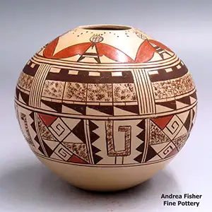 A polychrome seed pot with a 5-panel moth and geometric design around the body