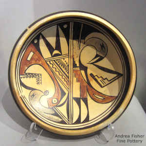 Polychrome bowl with fire clouds decorated with a bird element and geometric design
