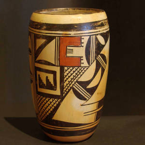 Geometric shard design on a polychrome cylinder