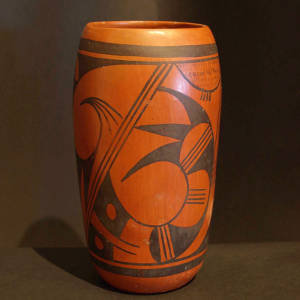 Black bird element and geometric design on a red-slipped jar