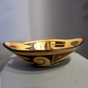 Bird element and geometric design on a polychrome serving bowl