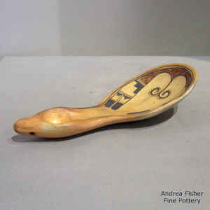 Polychrome ladle decorated with a bird element and geometric design