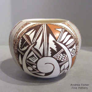 Bird element and geometric design decorate this polychrome seed pot