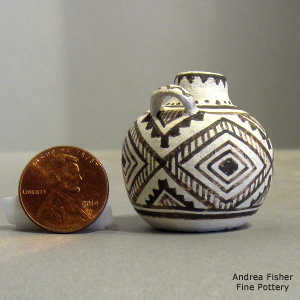Geometric design on a miniature black and white jar
