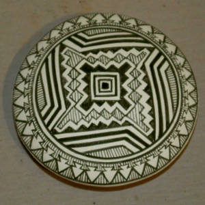 Mimbres geometric design on a black and white seed pot