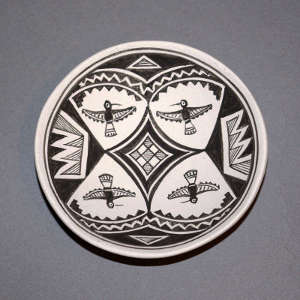 Mimbres thunderbird and geometric design on a black and white plate