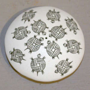 Turtle and geometric design on a black and white seed pot