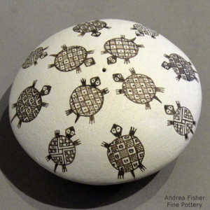 Turtle design on a black and white seed pot