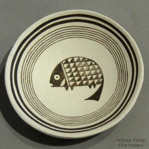 Mimbres fish design on a black and white plate