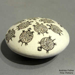 Mimbres turtle and geometric design on a black and white seed pot