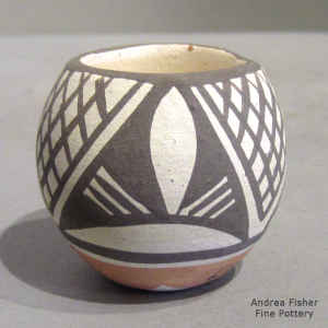 Miniature polychrome jar with a fine line and geometric design