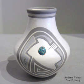 Polychrome jar with a turquoise inlaid in a geometric design