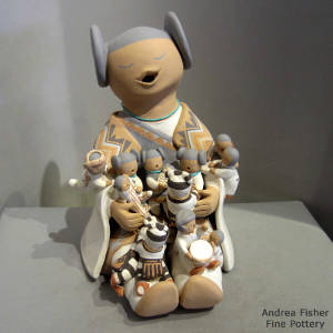 Three koshares and nine children on a grandmother storyteller