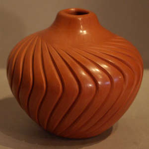 Carved red melon jar