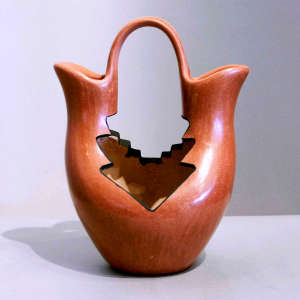 Geometric cutouts in a red wedding vase