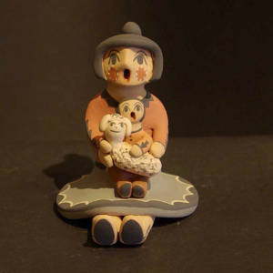 Circle skirt, one child and a lamb on a grandmother storyteller