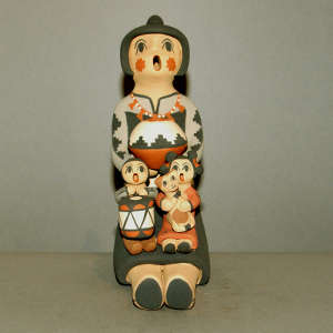 Two children and a kitten on a grandmother storyteller