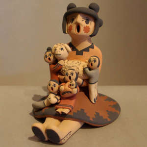 Five children and a lamb on a female storyteller