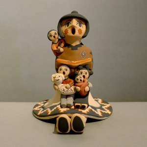 Four children on a grandmother storyteller