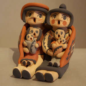 Four children on a mother and father storyteller