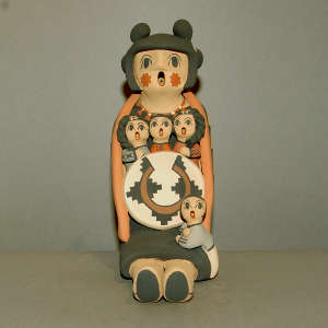 4 children on a grandmother storyteller